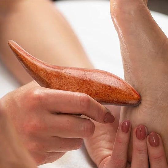 Gua Sha bois pied