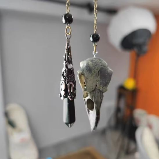 pendule corbeau et obsidienne pendu